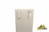Ensemble de chaine, pendentif et de boucles d’oreilles